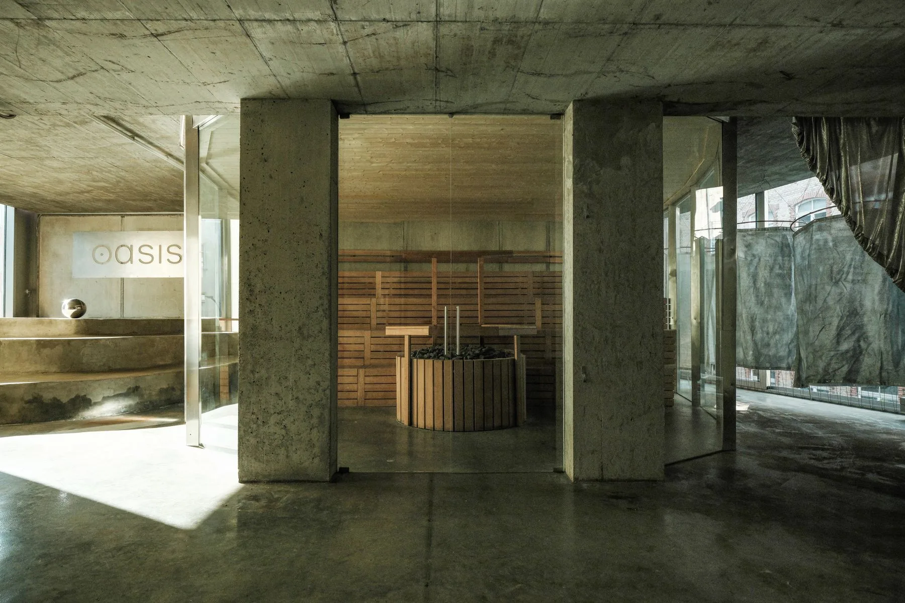 The ANTI spa: concrete columns opening onto a blonde-wood sauna and the Oasis lounge